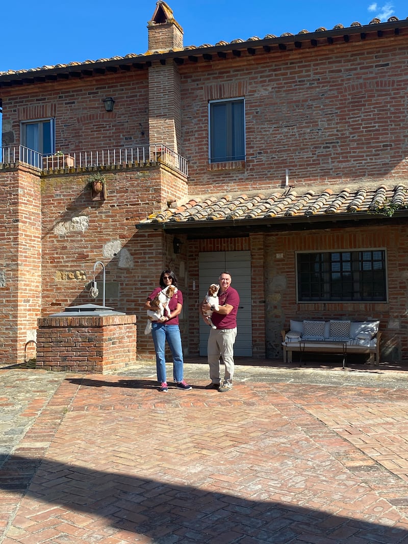 Paari and Niall O'Toole with their dogs at the 16th-century villa on Poggio Golo estate in Tuscany. Photograph: Michelle Porter