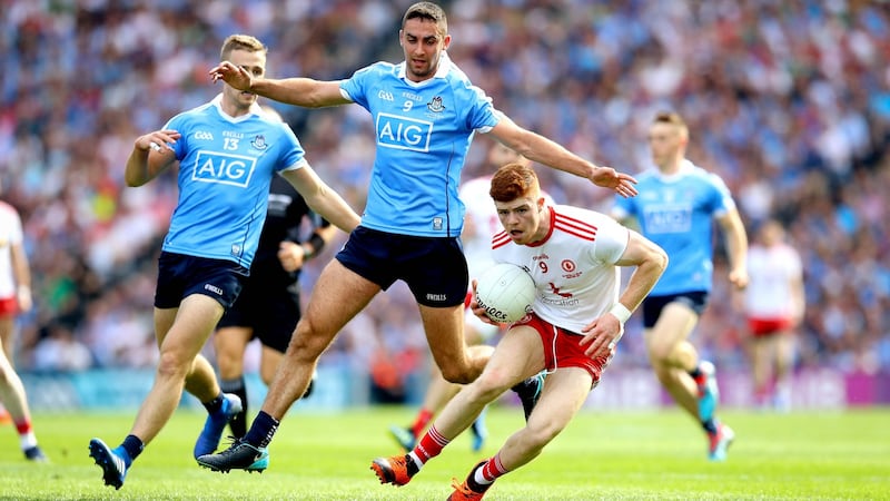 James McCarthy closes down Tyrone’s Cathal McShane. Photograph: Ryan Byrne/Inpho