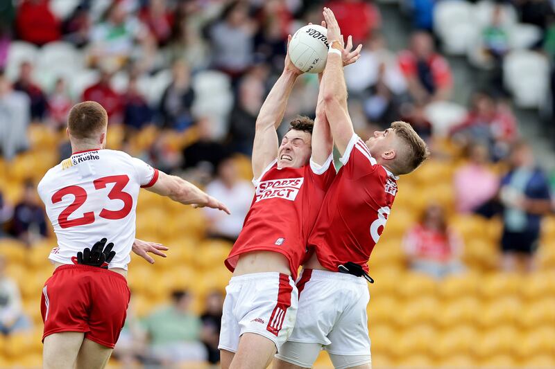 Cork's Killian O’Hanlon and Ian Maguire with Cathal McShane of Tyrone. Photograph: Laszlo Geczo/Inpho