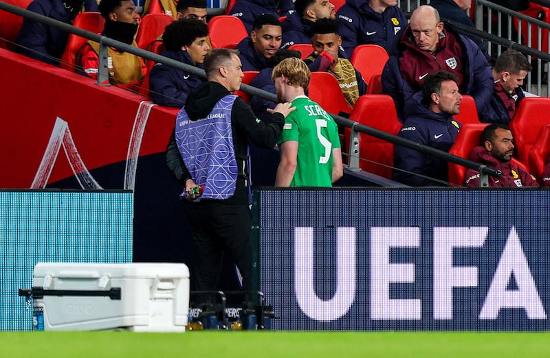 Ireland's Liam Scales leaves the pitch after receiving a second yellow card. Photograph: Ryan Byrne/Inpho