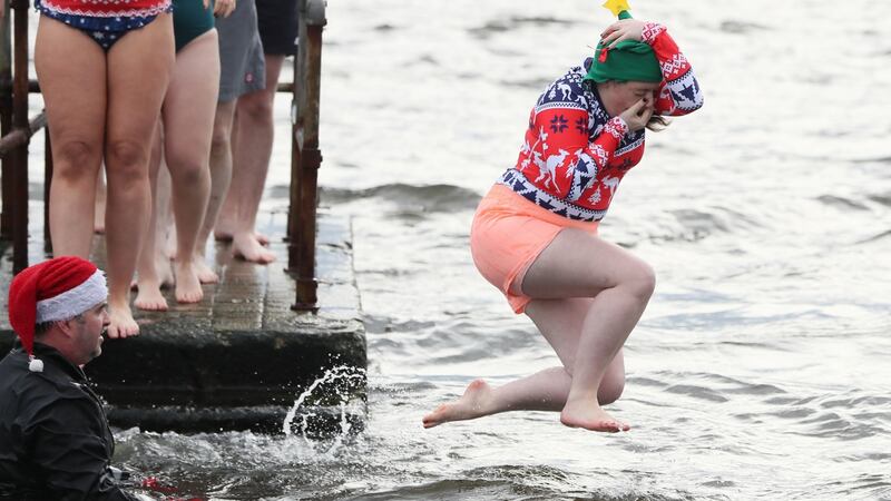 Orla Doogue takes part in the Clontarf Yacht & Boat Club annual Christmas swim in aid of the RNLI. Photograph: Brian Lawless/PA Wire