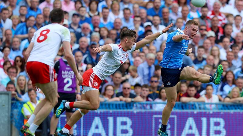 Ciarán Kilkenny gets past Michael McKernan of Tyrone. Photo: Tommy Dickson/Inpho