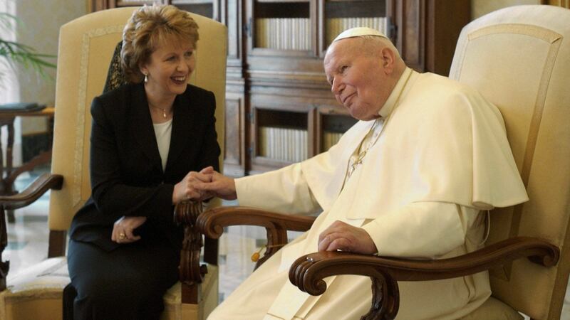 Pope John Paul II holds the hand of Irish President Mary McAleese during their meeting in  2003 in the Vatican. File Photograph:  Arturo Mari-Vatican Pool/Getty Images