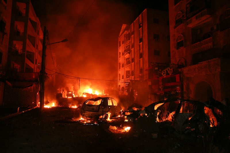 Cars set on fire during battles with government forces still ablaze shortly after jihadists entered central Aleppo early on Saturday. Photograph: Omar Haj Kadour/AFP/Getty 