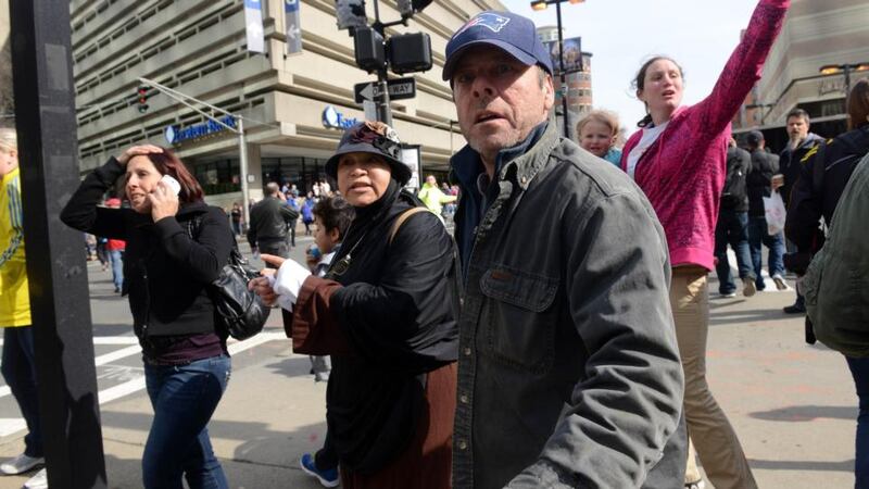 People look on at the corner of Stuart and Dartmouth St, near the finish line after two bombs exploded during the 117th Boston Marathon. Photograph:  Darren McCollester/Getty Images