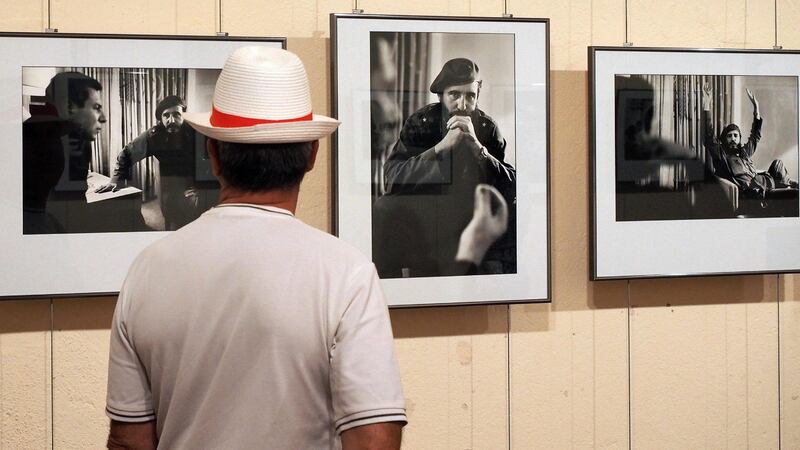 A visitor at Marc Riboud’s ‘Cuba’ exhibition in Perpignan. Photograph: Raymond Roig/AFP/Getty Images