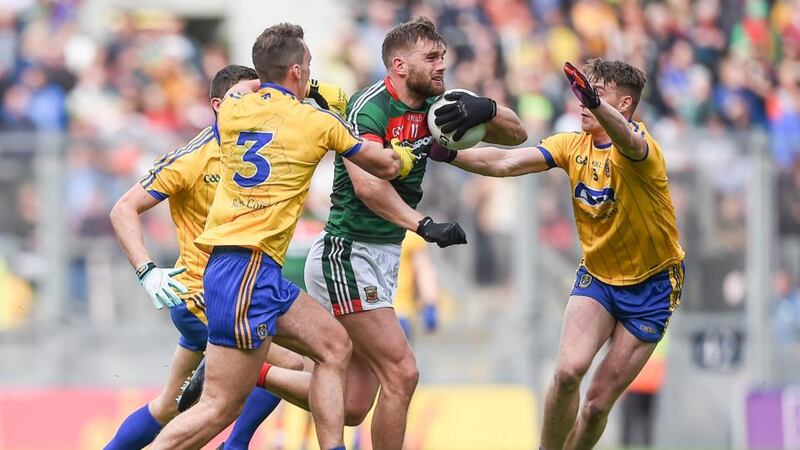 Mayo’s Aidan O’Shea is challenged by three Roscommon players during the drawn All-Ireland quarter-final. Photograph: Tommy Grealy/Inpho