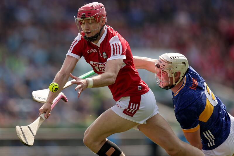 Cork's Alan Connolly gets away from Bryan O'Mara of Tipperary in their Munster Championship clash. Photograph: Inpho/Laszlo Geczo