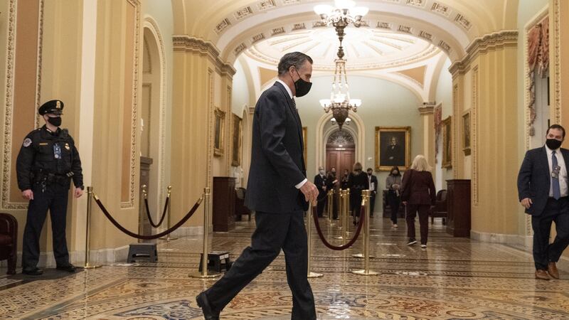 Republican senator Mitt Romney walks through the US Capitol on Friday as the Trump impeachment trial continued. Photograph:  Chris Kleponis/CNP/Bloomberg