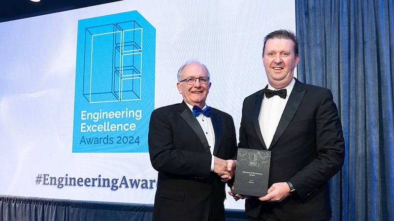 Matt Cotterell, awards judge, presents the operational excellence award to Pat Keane, Writech