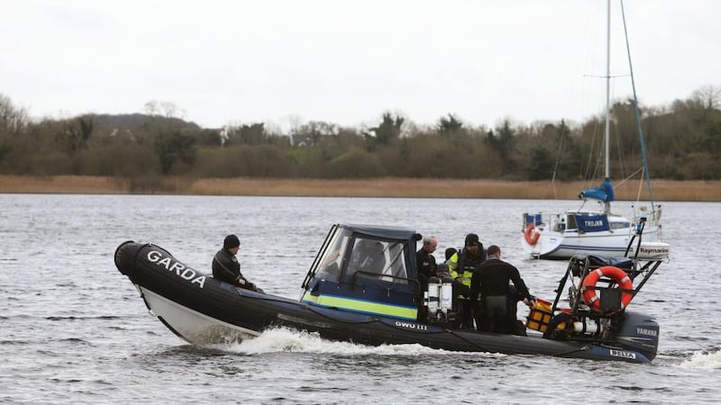 Members of the Garda sub aqua unit join the search of Lough Ree in Co Westmeath, for a man  missing after the boat he was in with two others capsized yesterday afternoon. Photograph: PA