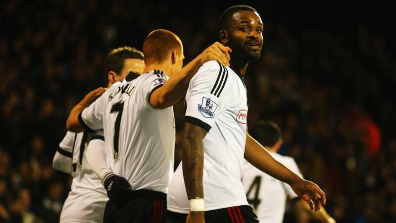 Darren Bent of Fulham celebrates with team mates after scoring the opener against Norwich City  at Craven Cottage. Photograph:  Clive Rose/Getty Images