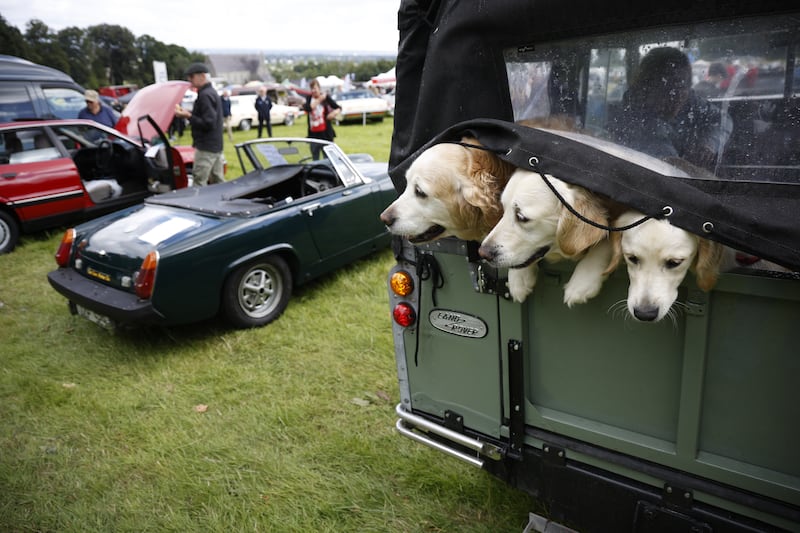 Three generation's 'Indy' (grandmother), 'Faye' (mother) and 
Marge (daughter) Charlesworth exiting a 1970's Series 3 SWB Landrover at the Bohernabreena Classic Car show and fair in the Church field. Photograph Nick Bradshaw / The Irish Times
