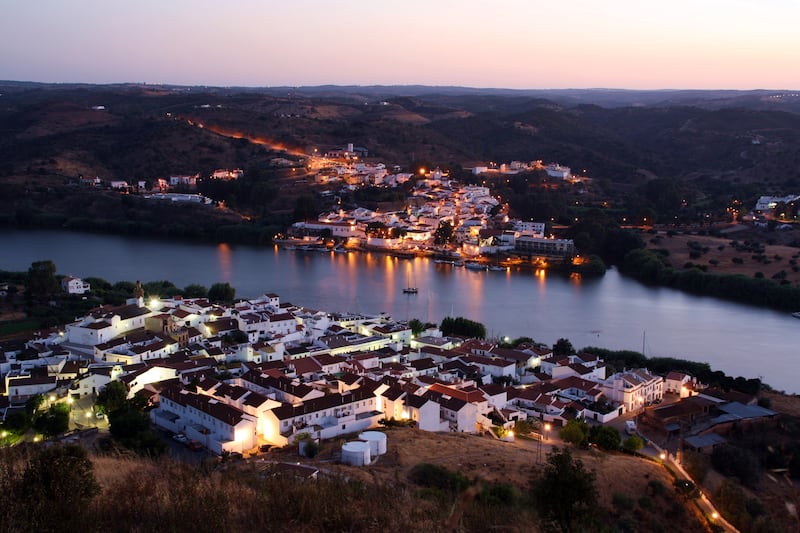 Sunset on the border marked by the Guadiana river between Spain and Portugal. Photograph: angeluisma/Getty Images/iStockphoto