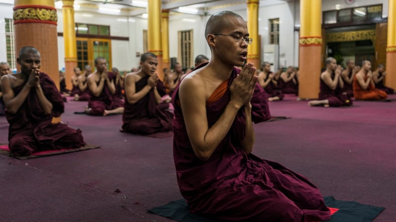 Monks pray in the Bengala monastery in Yangon, Myanmar. Photograph: Adam Dean/The New York Times