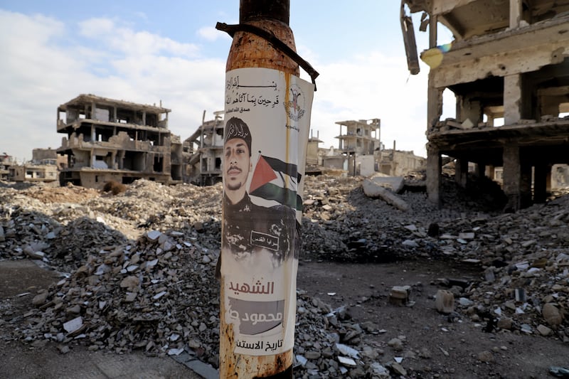 Posters of slain Hamas and Islamic Jihad fighters are plastered on building fronts around Yarmouk. Photograph: Hannah McCarthy