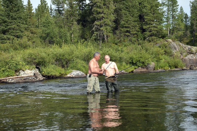 Sergei Shoigu, then Russian defence minister, and president Vladimir Putin fish in the remote Tuva region in southern Siberia. Photograph: Alexy Nikolsky/AFP via Getty Images