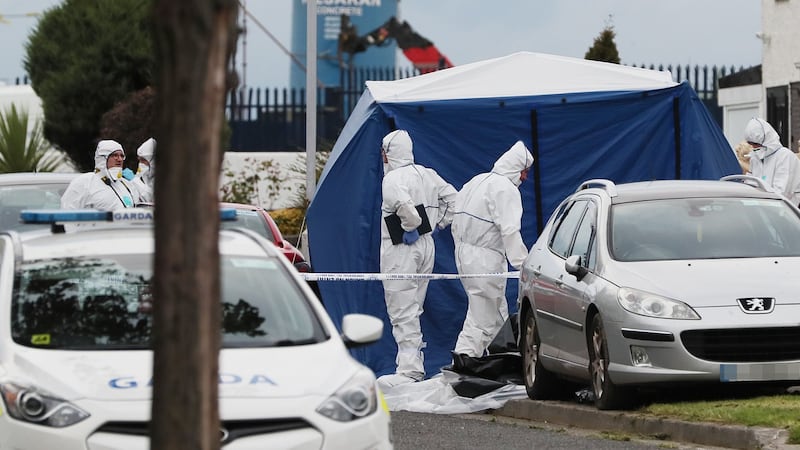 Forensics at the scene on Balbutcher Drive in Ballymun, Dublin, where a man and a woman were shot dead on Wednesday afternoon. Photograph: Brian Lawless/PA Wire