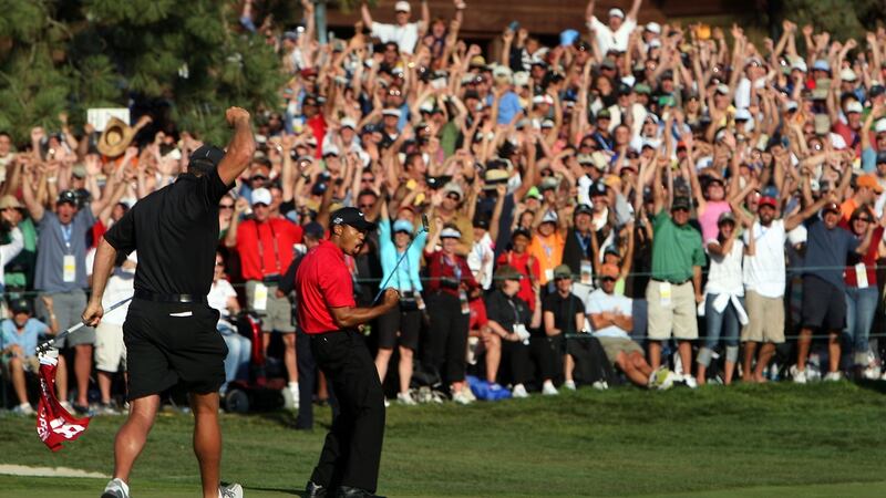 Steve Williams runs towards Tiger Woods as he celebrates his birdie putt on the 18th green to force a playoff with Rocco Mediate during the final round of the 108th U.S. Open at  Torrey Pines in 2008. Photograph: Donald Miralle/Getty Images