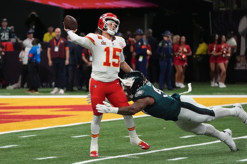 Kansas City Chiefs quarterback Patrick Mahomes tries to evade Eagles defensive tackle Jalen Carter. Photograph: Timothy A. Clary/AFP 