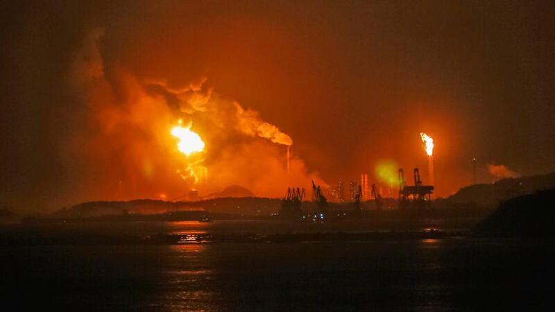 A general view showing fire and smoke after the explosion. Photograph: EPA/Liu Haibin