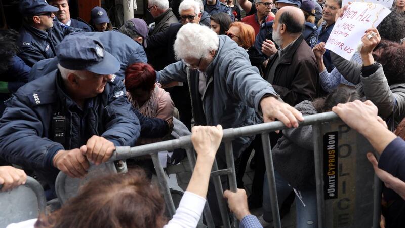 Protesters scuffle with police at Ledra’s checkpoint of the UN-controlled buffer zone last week after authorities declared the crossing temporarily shut to curb any potential spread of the new coronavirus in Nicosia, Cyprus. Photograph: Yiannis Kourtoglou/Reuters