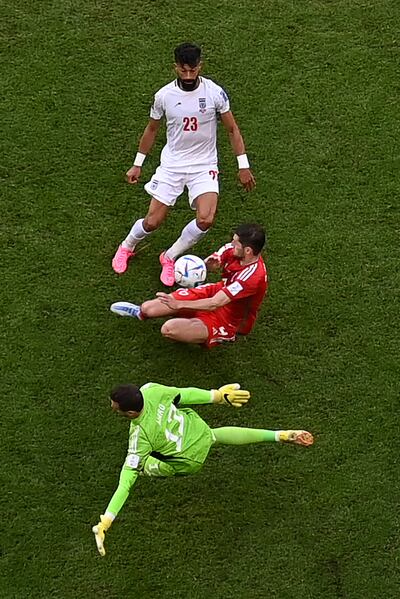 Iran's Ramin Rezaeian scores his team's second goal during the World Cup Group B match against Wales at the Ahmad Bin Ali Stadium. Photograph: Anne-Christine Poujoulat/AFP via Getty Images