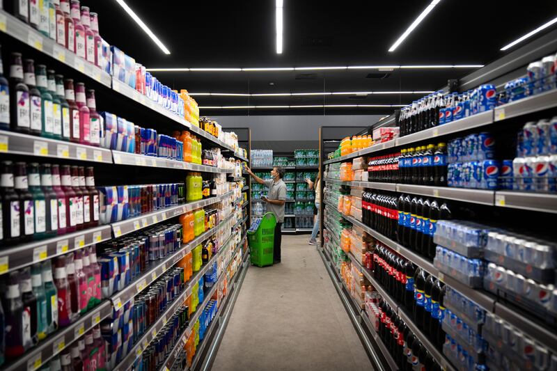 Small shops and even a grocery store serve visitors staying in the Fan Village. Photograph: Erin Schaff/The New York Times