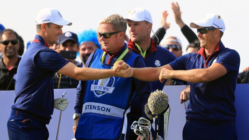 Team Europe’s Justin Rose (left) celebrates his tee shot with Henrik Stenson on the 11th hole. Photograph: Gareth Fuller/PA Wire.