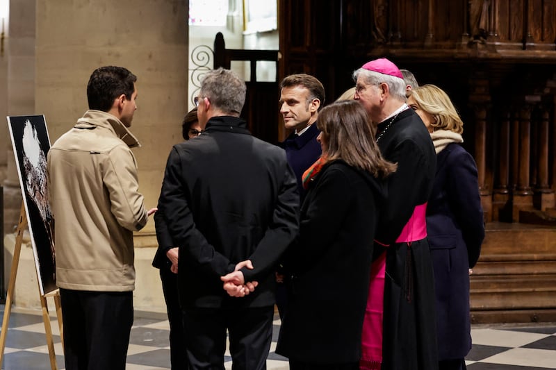 French president Emmanuel Macron, Paris' mayor Anne Hidalgo and Paris' archbishop Laurent Ulrich. Photograph: Stephane De Sakutin/AFP/Getty Images