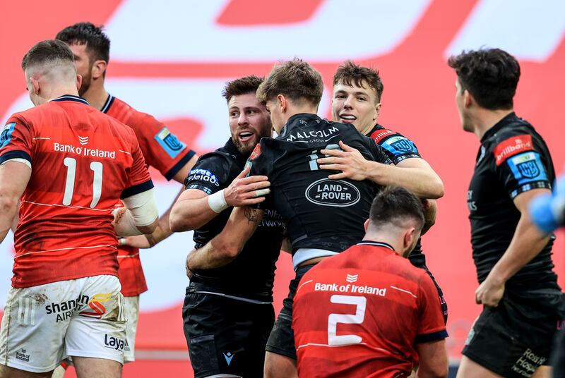 Glasgow’s Domingo Miotti celebrates scoring a try with Ali Price and Jamie Dobie during the victory over Munster at Thomond Park. Photograph: Dan Sheridan/Inpho 