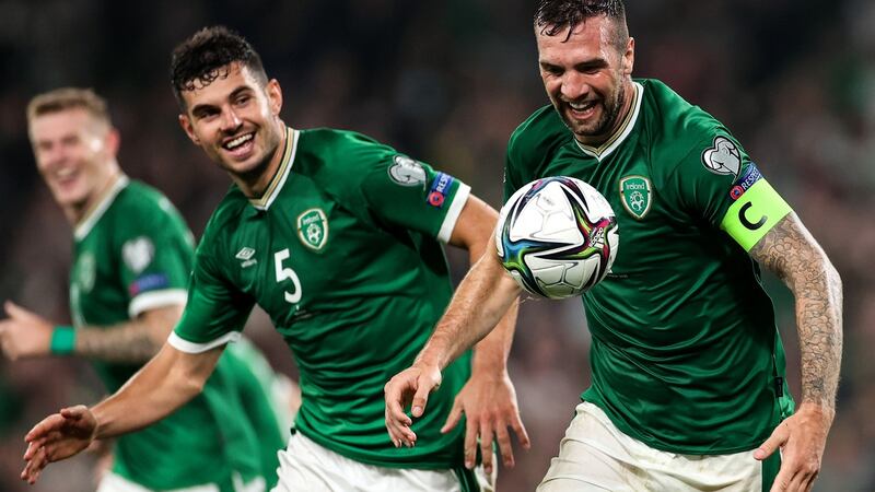 Shane Duffy and John Egan celebrate the equaliser against Serbia. Photo: James Crombie/Inpho