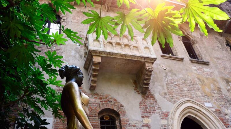 Juliet’s balcony and statue in Verona: touching her right breast is said to bring luck in love. Photograph: Getty Images