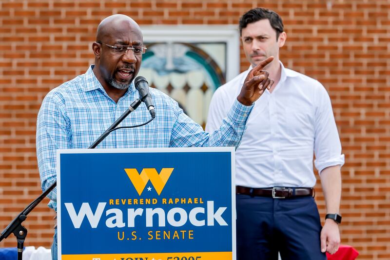 Democratic US senator from Georgia Raphael Warnock (left) campaigns with fellow Georgia senator Jon Ossoff in Monroe on Thursday. Photograph: Erik S Lesser/EPA-EFE