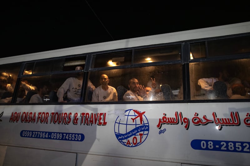 Freed Palestinian prisoners react as they arrive on a bus at the European Hospital in Khan Younis, southern Gaza Strip. Photograph: EPA