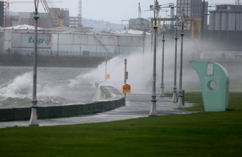 Waves crash over the sea wall in Clontard on Friday afternoon. Photograph: Alan Betson/The Irish Times

