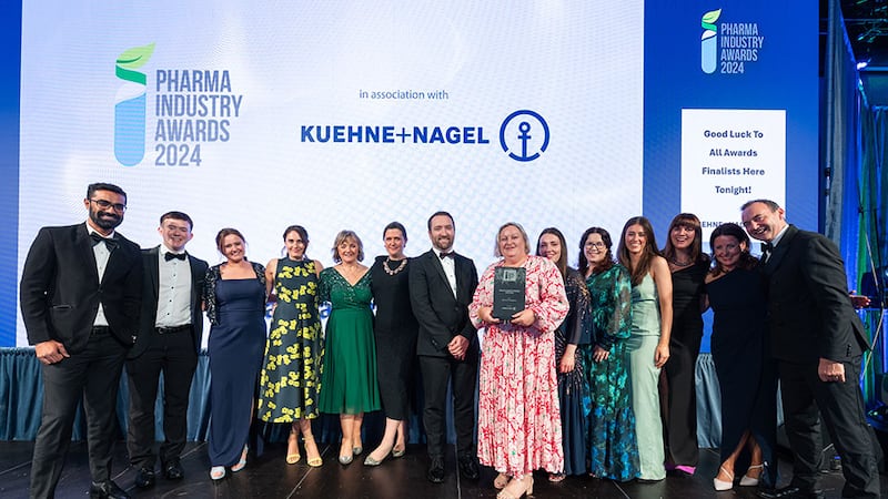 Seamus Keane, VP pharma and healthcare Europe at Kuehne+Nagel Limited, presents the Pharma Industry Company of the Year to the APC & VLE Therapeutics team