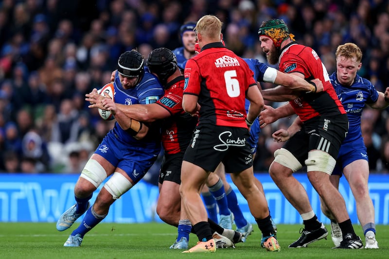 Leinster's Caelan Doris is tackled by Juan Schoeman of Emirates Lions. Photograph: Ben Brady/Inpho