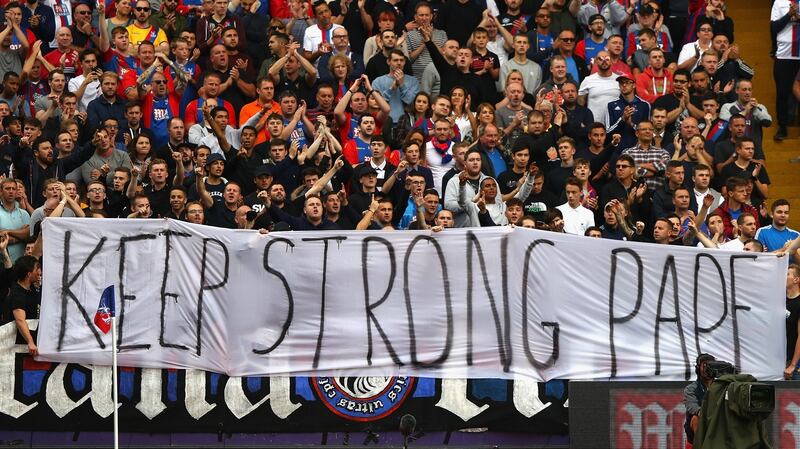 Crystal Palace fans display a banner of support to Pape Souaré in the first game after his crash. Photograph: Ian Walton/Getty