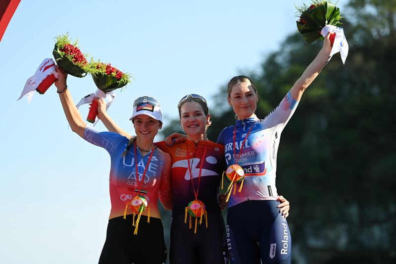 Italy's Chiara Consonni (second), Poland's Daria Pikulik (winner) and Mia Griffin (third) on the podium  after a stage of the Tour of Guangxi women's elite world challenge on October 17th, 2023, in Guilin, China. Photograph: Tim de Waele/Getty Images