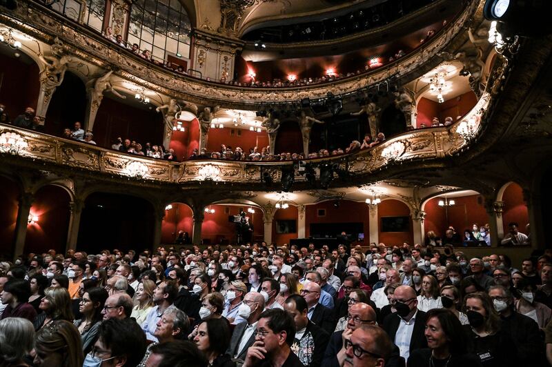 People attend Angela Merkel's conversation with Alexander Osang 'So what is my country?' at the Berliner Ensemble in Berlin. Photograph: Filip Singer/EPA-EFE