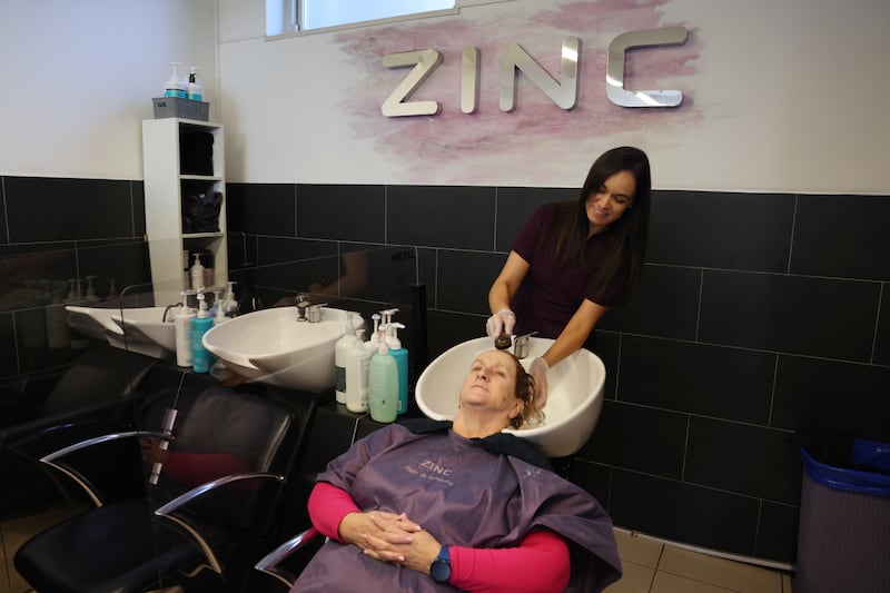 Cepta Sheppard  has her hair washed by Stacey Martin at Zinc Hair and Beauty Salon in Kilmainham Dublin. Photograph: Bryan O’Brien

