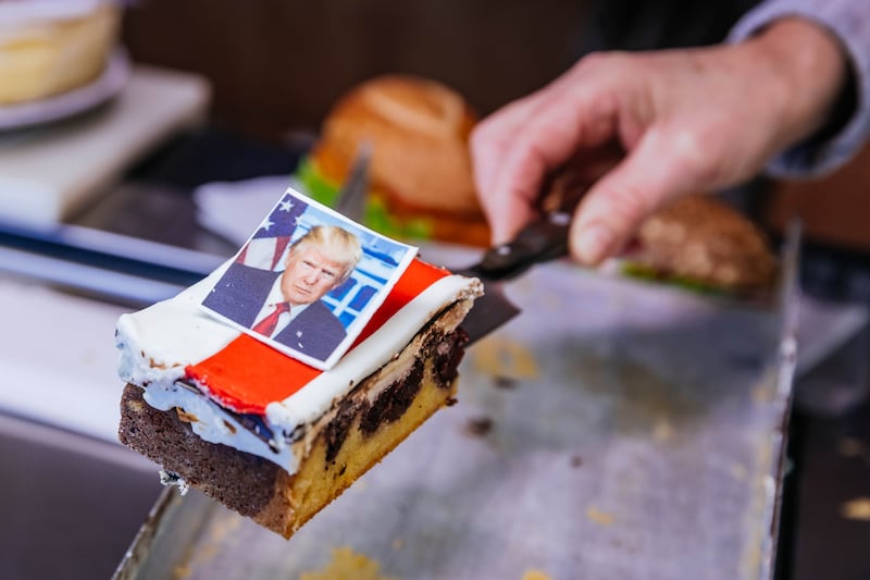 A bakery in Freinsheim, Germany, presents cake slices adorned with a portrait of Donald Trump and an American flag to mark his inauguration as US president on Monday. Donald Trump's grandfather Friedrich, or Frederick, was born in the nearby village of Kallstadt and emigrated to the USA in 1885. Photograph: Thomas Niedermueller/Getty Images