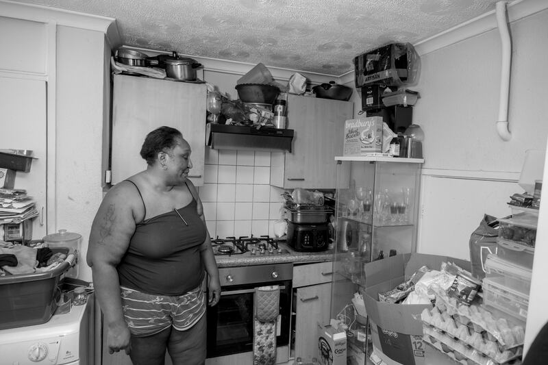 Kiara, substandard housing, Newham. "The council and landlord just don’t care, there are cockroaches and leaks and dangerous windows and wiring, and they do nothing. Even now I must use this stick to turn off the lights because if you touch the switch, you get electrocuted." Photograph: Marc Davenant