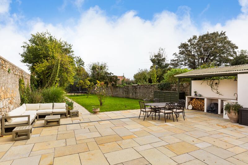 There's an outdoor kitchen area with a sink for those barbecue nights during the summer.