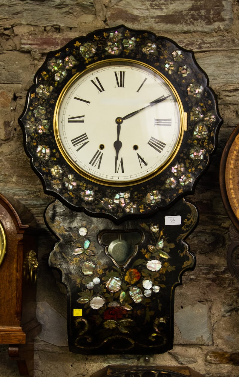 Victorian papier-mâché drop dial wall clock with a pendulum (€120-€180)