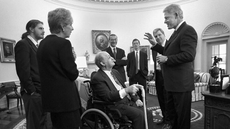 James Brady (C), along with wife Sarah and son Scott (L) meet with president Bill Clinton in the Oval Office moments before the dedication of the press office in Brady’s honor in Washington in this file photo from February 11th, 2000. Photograph: Reuters