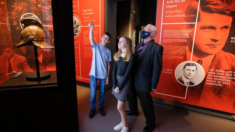 Aoife and Jack Deery with their grandfather, Joey Lonergan, at the Custom House   Visitor Centre. Photograph: Naoise Culhane