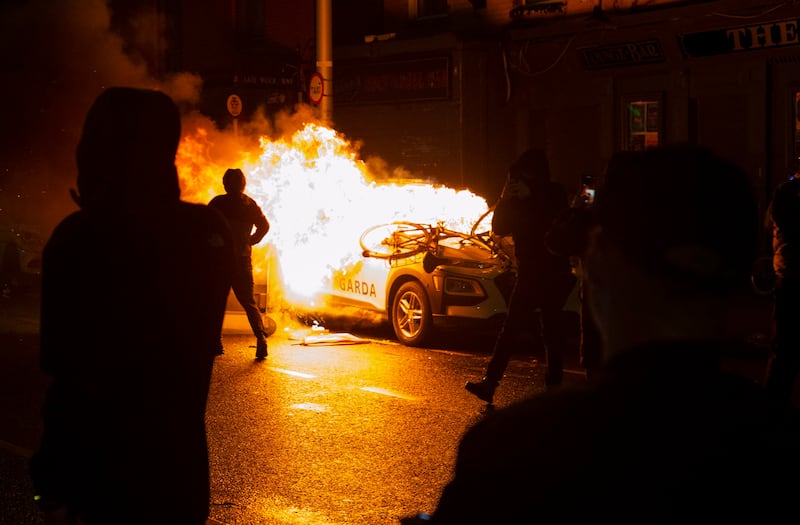 23/11/2023 A Garda car set on fire during  Scenes from Dublins North inner City last November Picture: Colin Keegan, Collins Dublin