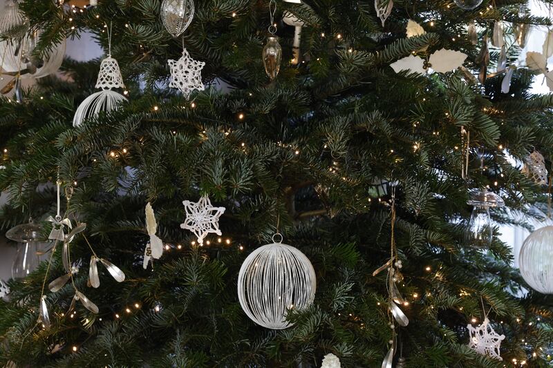 Reception room Christmas tree: A Nordmann fir whose decorations include Georg Jensen angels. 'They don’t make them anymore. Royal Copenhagen make annual decorations. I have a few of them too.' Photograph: Nick Bradshaw